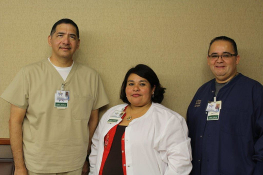 Rural Health Clinic Staff smiling. There is one female and two males