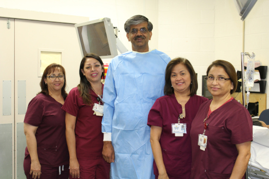 G.I. Department smiling. There is four females and one male