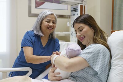 Female Mother holding her newborn